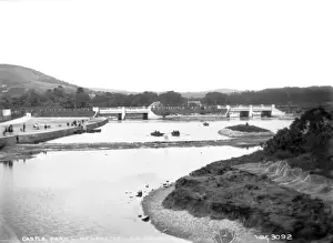 Prints of Castle Park, Newcastle, Co, Down - a view of the boating lake in the centre of the town, there are people rowing and onlookers and in the distance two bridges Down Prints: Castle Park, Newcastle, Co. Down Print - Early 1900s