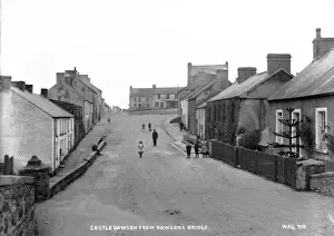 Prints of Castledawson from Dawsons Bridge - a view down the main street with people on the road. (Location: Northern Ireland: County Londonderry: Castledawson). Date: circa early 1900s Derry Prints: Castledawson Print - Early 1900s View from Dawsons Bridge