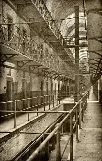Prints of The interior of a cell block at Wakefield Prison, West Yorkshire. Cells line the open galleries which have a safety net strung across to prevent inmates falling West Yorkshire Prints: Wakefield Prison Cell Block Print, West Yorkshire, 1594