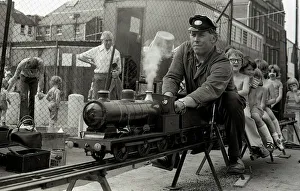 Children enjoy a ride on a model steam train Children enjoy a ride on a model steam train