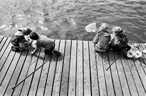 Children fishing for crabs on wooden pontoon, New Brighton Children fishing for crabs on wooden pontoon, New Brighton