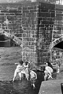 Children play in the water of Hebden Beck Children play in the water of Hebden Beck