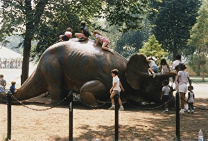 Children playing on a Dinosaur Model Children playing on a Dinosaur Model