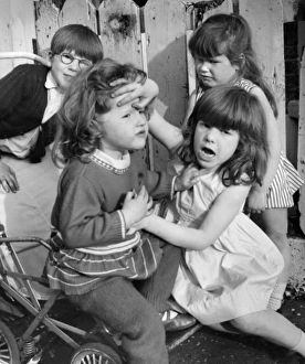 Children playing doctors and nurses, Balham, SW London Children playing doctors and nurses, Balham, SW London