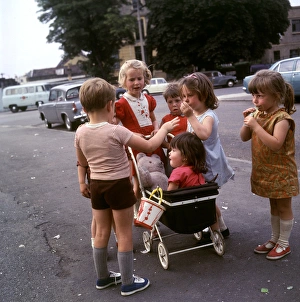 Children with toy pram, Balham, SW London Children with toy pram, Balham, SW London