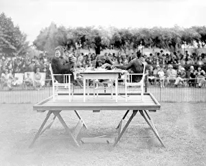Prints of High tea - three chimpanzees having a tea party at London Zoo, watched by a large crowd. Date: early 1930s Chimpanzee Prints: Chimps Tea Party Print, London Zoo, Early 1930s