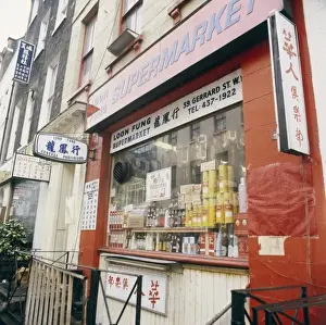 Prints of The shop front of a Chinese store on Gerrard Street, Chinatown, central London. Date: 1978 Related Prints: 1978 Print of a Chinese Store on Gerrard Street in London's Chinatown