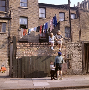 Chldren on a wall, with washing, Balham, SW London Chldren on a wall, with washing, Balham, SW London