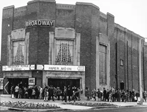 Prints of Queuing to see The Golden Voyage of Sinbad at the Broadway cinema, Letchworth Garden City, Hertfordshire, England Date: circa 1969 Poster Prints: Cinema Queue at Letchworth Garden City Print circa 1969