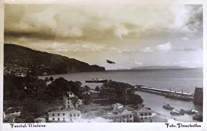 Coastal view of Funchal, Madeira with seaplane taking off Coastal view of Funchal, Madeira with seaplane taking off