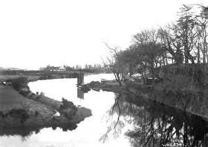 Prints of The Comber River, Co. Down - a view of a bend in the river with a boat visible. (Location: Northern Ireland; County Down; Comber). Date: circa early 1900s River Prints: The Comber River Print, Northern Ireland circa early 1900s