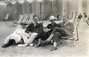 Couples sit in deckchairs on the beach at Margate, Kent Couples sit in deckchairs on the beach at Margate, Kent