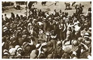 Prints of A Crowd of Syrian Arab men and women in traditional costume at a seasonal festival Date: circa 1930s Festivals Through The Ages Prints: Syrian Arab Festival Print circa 1930s