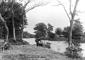 Prints of The Crumlin River - a view of a rowing boat and people at the edge of the river. (Location: Northern Ireland; County Antrim; Crumlin). Date: circa early 1900s River Prints: Crumlin River Print - Early 20th Century Northern Ireland