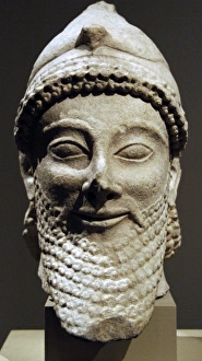 Cyprus. Limestone male head wearing a helmet with a bird. Ar Cyprus. Limestone male head wearing a helmet with a bird. Ar