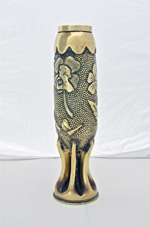 Decorated 75mm shell case with a fluted bottom Decorated 75mm shell case with a fluted bottom