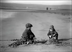 A Devon Beach Scene Print: Two Boys Building a Sandcastle