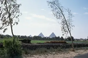 Barren Sahara Desert Scene Prints: Distant View of Pyramids