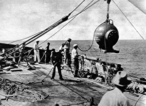 Prints of Photograph of Dr. William Beebes bathysphere being lowered into the sea off St. George, Bermuda, 11th August 1934. On this occasion Dr Bermuda Prints: Dr. Beebe's Bathysphere Descent, August 1934 Print