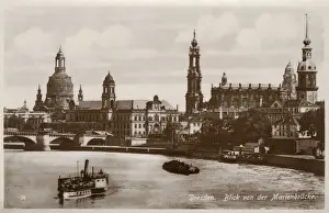 Prints of Dresden, Germany - The Augustus Bridge, the oldest bridge in the city crossing the river Elbe. The bridge connects the Innere Neustadt in the north with the historic area of the city in the south River Prints: Dresden, Germany - Augustus Bridge Print circa 1920s