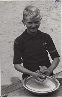 Dutch boy scout scrubbing his fingernails, Holland Dutch boy scout scrubbing his fingernails, Holland