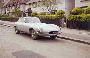 Prints of An E Type Jaguar car, parked on a suburban London street. Date: 1960s Jaguar Prints: E Type Jaguar Print, London Street Scene, 1960s