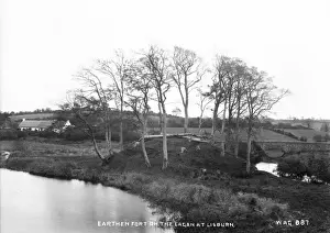 Prints of Earthen Fort on the Lagan at Lisburn - a view of an earthen fort surrounded by trees beside the Lagan. (Location: Northern Ireland: County Antrim: Lisburn). Date: circa early 1900s Lisburn Prints: Earthen Fort on the Lagan at Lisburn Print