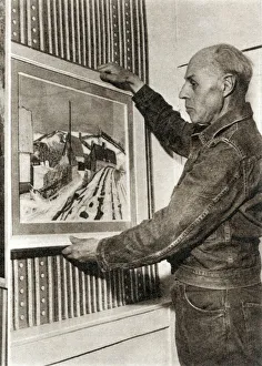 Edward Bawden hanging his painting of Waltham Cross Edward Bawden hanging his painting of Waltham Cross