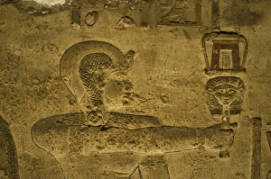 Egyptian Art. Dendera. Hathor Temple. The god Ihy holding a Egyptian Art. Dendera. Hathor Temple. The god Ihy holding a