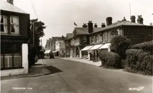 Prints of The Village, Freshwater, near Totland, Isle of Wight, England. Showing Elliotts Library Date: 1920s Palace Prints: Elliotts Library & Palace Cinema, Freshwater Print 1920s
