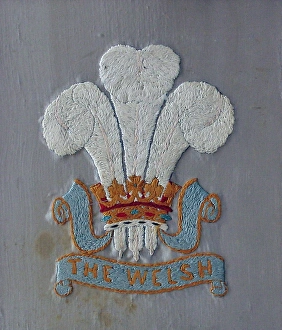 Embroidered badge of The Welsh Regiment Embroidered badge of The Welsh Regiment