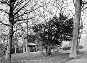 Prints of In Falls Park, Belfast. The Fretwork of the Sky - a view of the Falls park and Bandstand with overhanging trees and branches. (Location: Northern Ireland: County Antrim: Belfast) Belfast Prints: Early 20th Century Print of Falls Park, Belfast