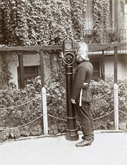 Firefighter using telephone point in street Firefighter using telephone point in street