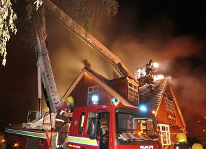 Firefighters working at scene of restaurant fire Firefighters working at scene of restaurant fire