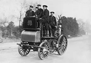Early Firefighting Equipment Prints: Firemen riding a fire engine
