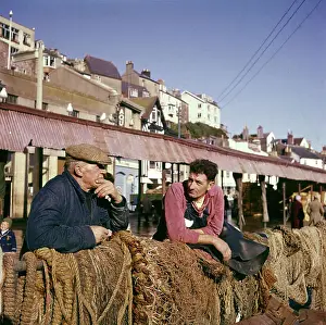 Devon Seaside Resort Prints: Two fishermen in Brixham Harbour, Devon