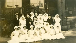 Formal group of nurses, older ladies, churchman Formal group of nurses, older ladies, churchman
