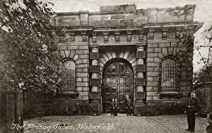 Prints of Prison officers stand at the entrance gates of Wakefield prison. Date: circa 1929 West Yorkshire Prints: Wakefield Prison Gates Print, circa 1929