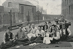 Gordon Highlanders making kilts in the open air Gordon Highlanders making kilts in the open air
