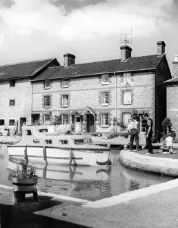Prints of The motor cruiser Jemima, in the lock at Stoke Bruerne, on the Grand Union Canal, Northamptonshire, England. Date: 1960s Northamptonshire Prints: Grand Union Canal Lock Print, Stoke Bruerne, 1960s