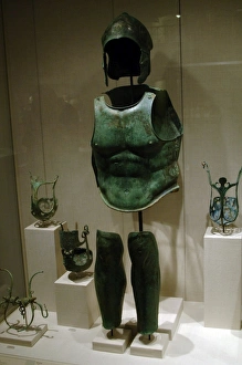 Greek art. Magna Graecia. Bronze helmet, cuirass and shin gu Greek art. Magna Graecia. Bronze helmet, cuirass and shin gu