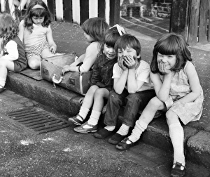 Group of children sittiing on kerb, Balham, SW London Group of children sittiing on kerb, Balham, SW London