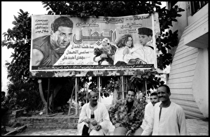 Group of men and film poster Alexandria, Egypt Group of men and film poster Alexandria, Egypt
