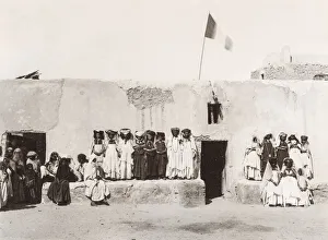 Group of women, Ouled Nail Algeria, French flag flying Group of women, Ouled Nail Algeria, French flag flying
