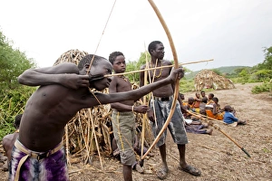 Hadzabe Tribal Boys - with bow and arrow - less Hadzabe Tribal Boys - with bow and arrow - less