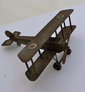 A hand-made wooden model of a WWI biplane A hand-made wooden model of a WWI biplane