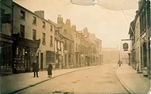 Prints of High Street, Uppingham, near Corby/Stamford, Leicestershire, England. Showing the Crown Inn. Date: 1910 Leicestershire Prints: High Street, Uppingham Print, 1910