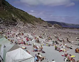 Cornish Seaside Resort Prints: Holidaymakers on the beach at Looe, Cornwall