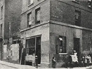Prints of A run-down building described as a House to Let on Chapel Street, Spital Square, Spitalfields, in the East End of London. A line of children watch the photographer Slums Prints: House to Let, Chapel Street, Spitalfields Print 1887