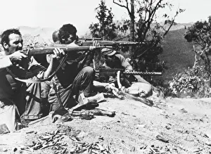 Prints of Infantrymen of the U.S. Mars Task Force unit attack Japanese troops in the Burma Road Sector, 80 miles north of Lashio Related Prints: 1944 U.S. Mars Task Force Burma Road Print